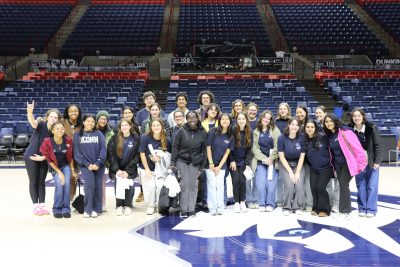 Group of students on the court of Gampel after a Green Game Day event 